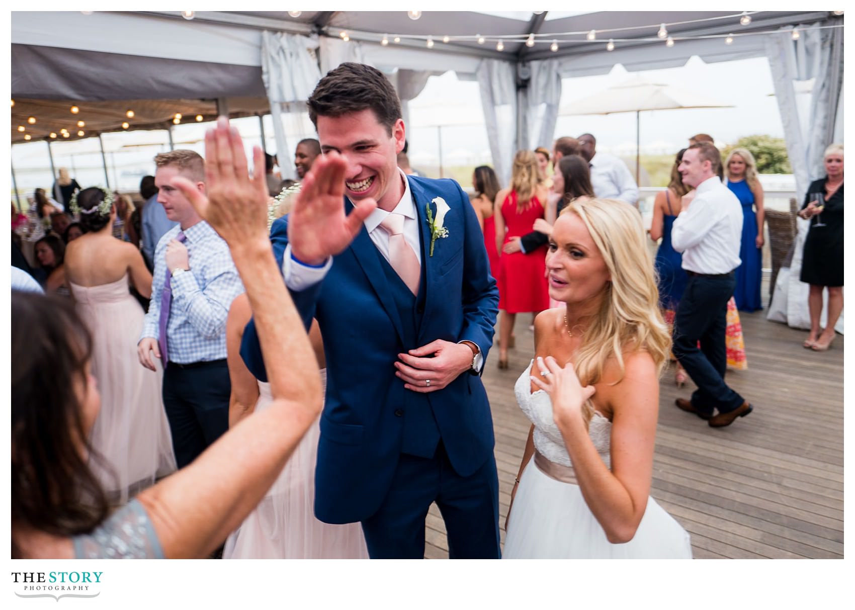 Groom high fives his mother after first dance at CBI wedding in Chatham, MA
