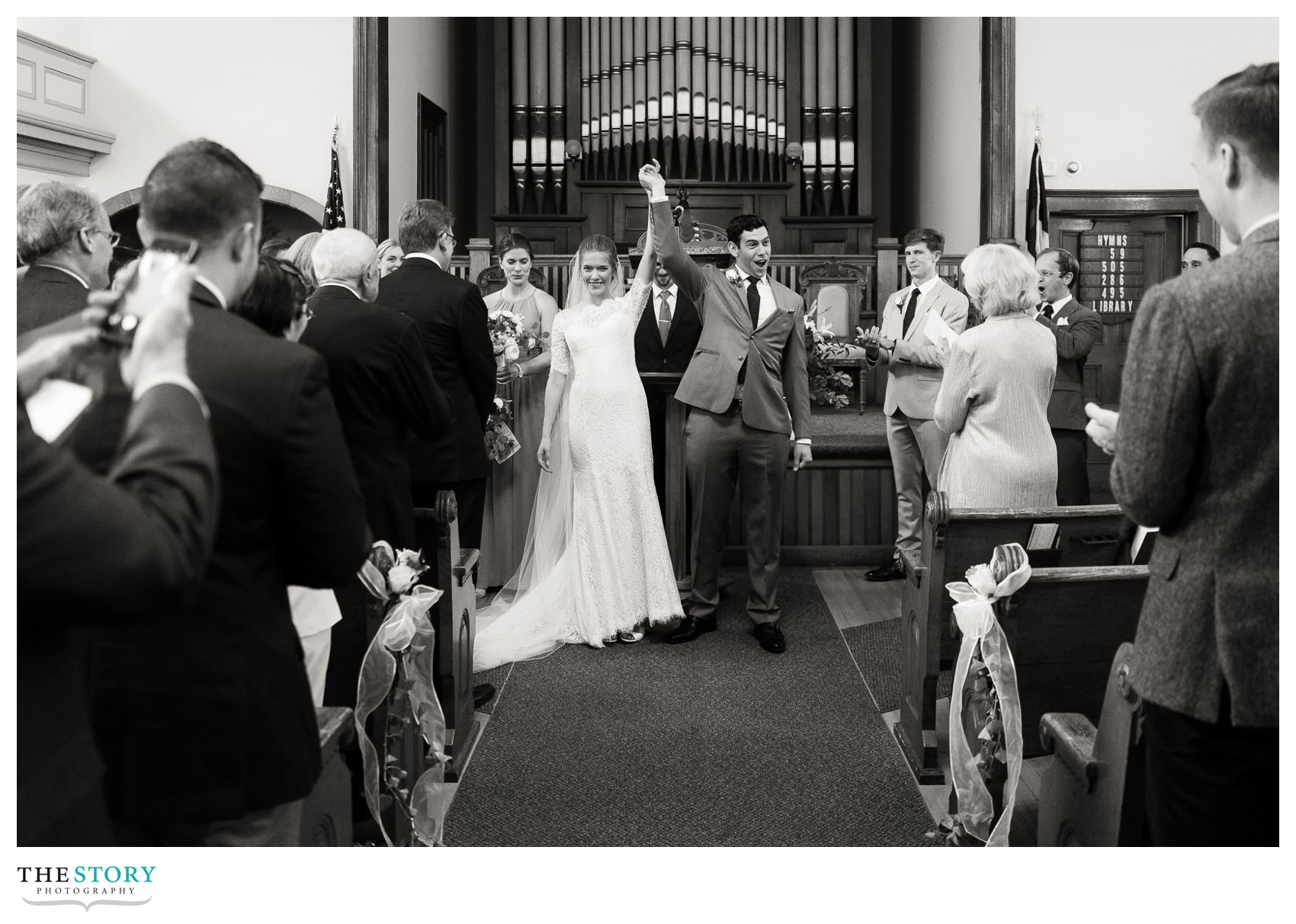 bride and groom celebrate the announcement of their marriage at Skaneateles First Baptist Church