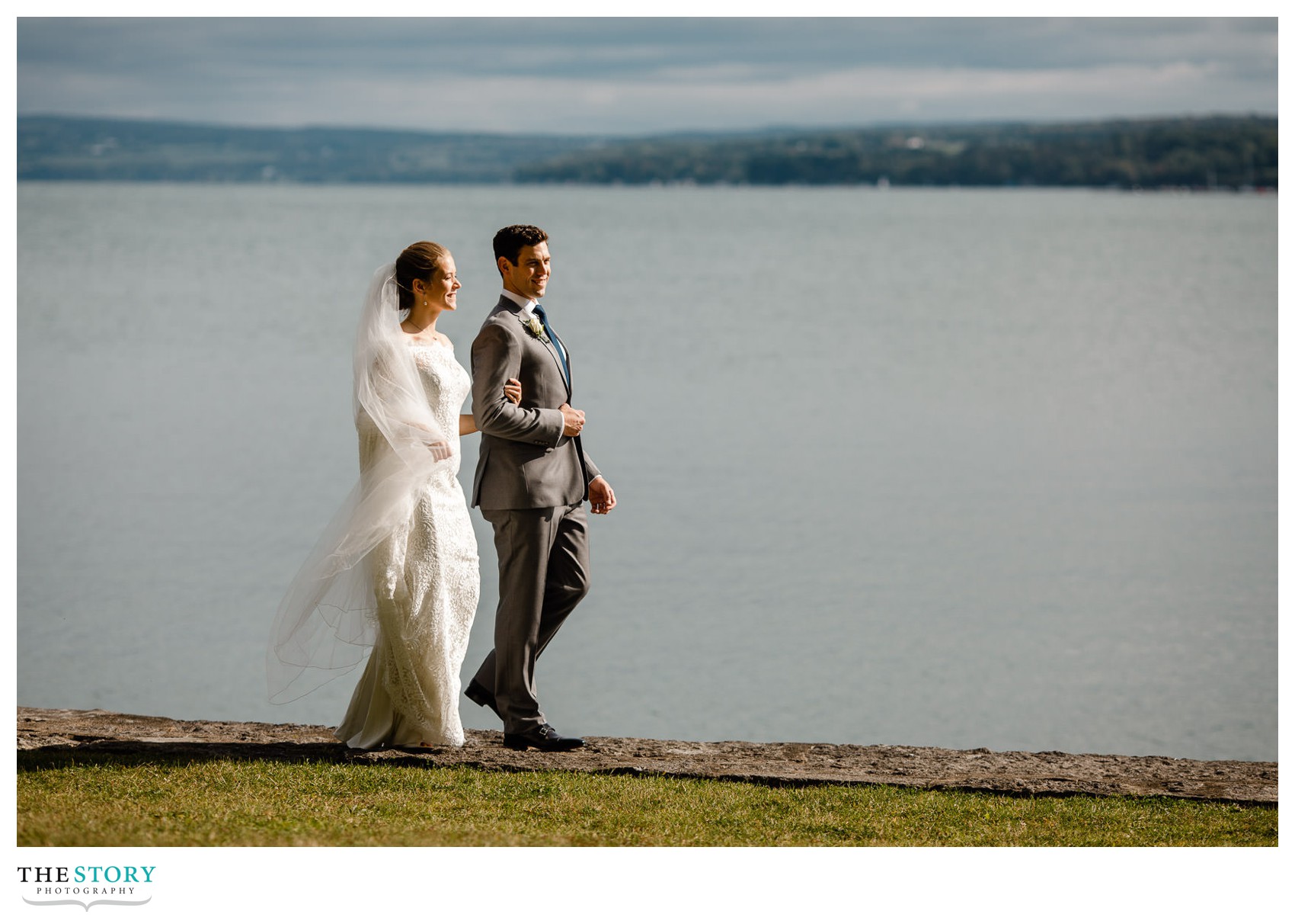 wedding day in Skaneateles with bride and groom on the lakeside in Thayer Park