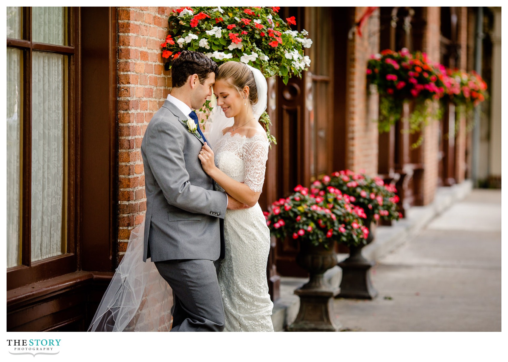 bride and groom share a moment in the village of Skaneateles