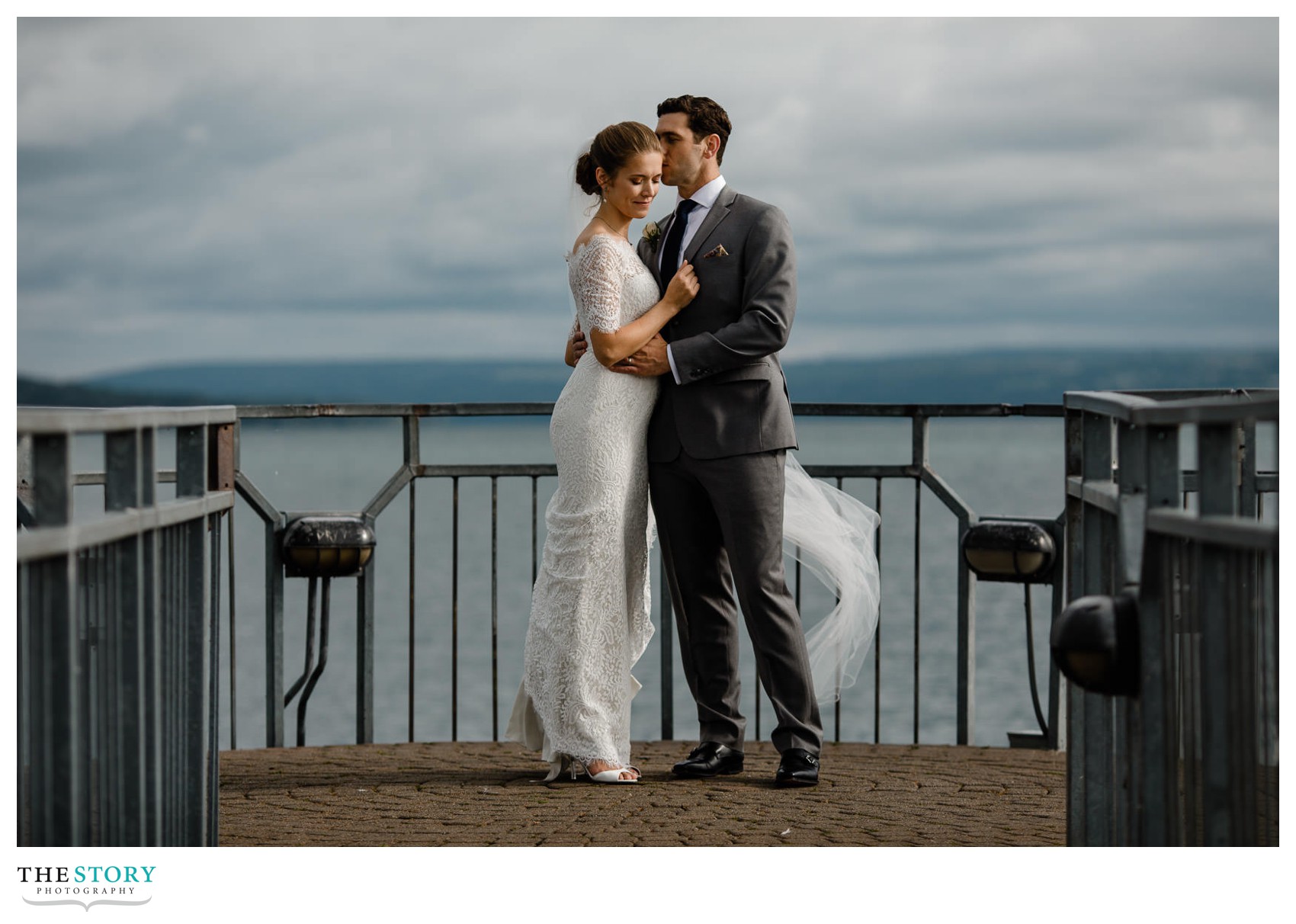 wedding photography with bride and groom on the pier in Skaneateles