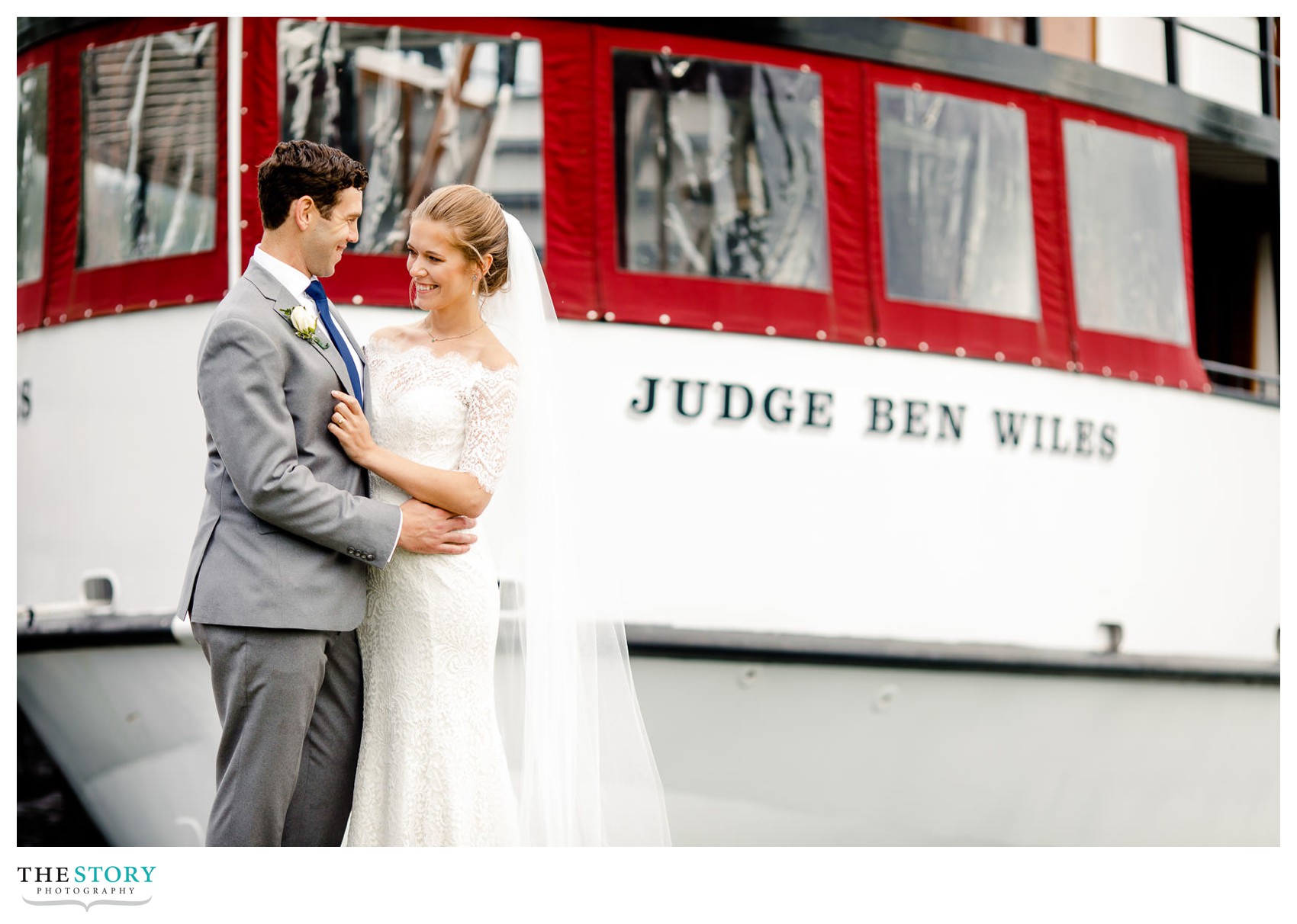 wedding day portrait of bride and groom in front of the Judge Ben Wiles