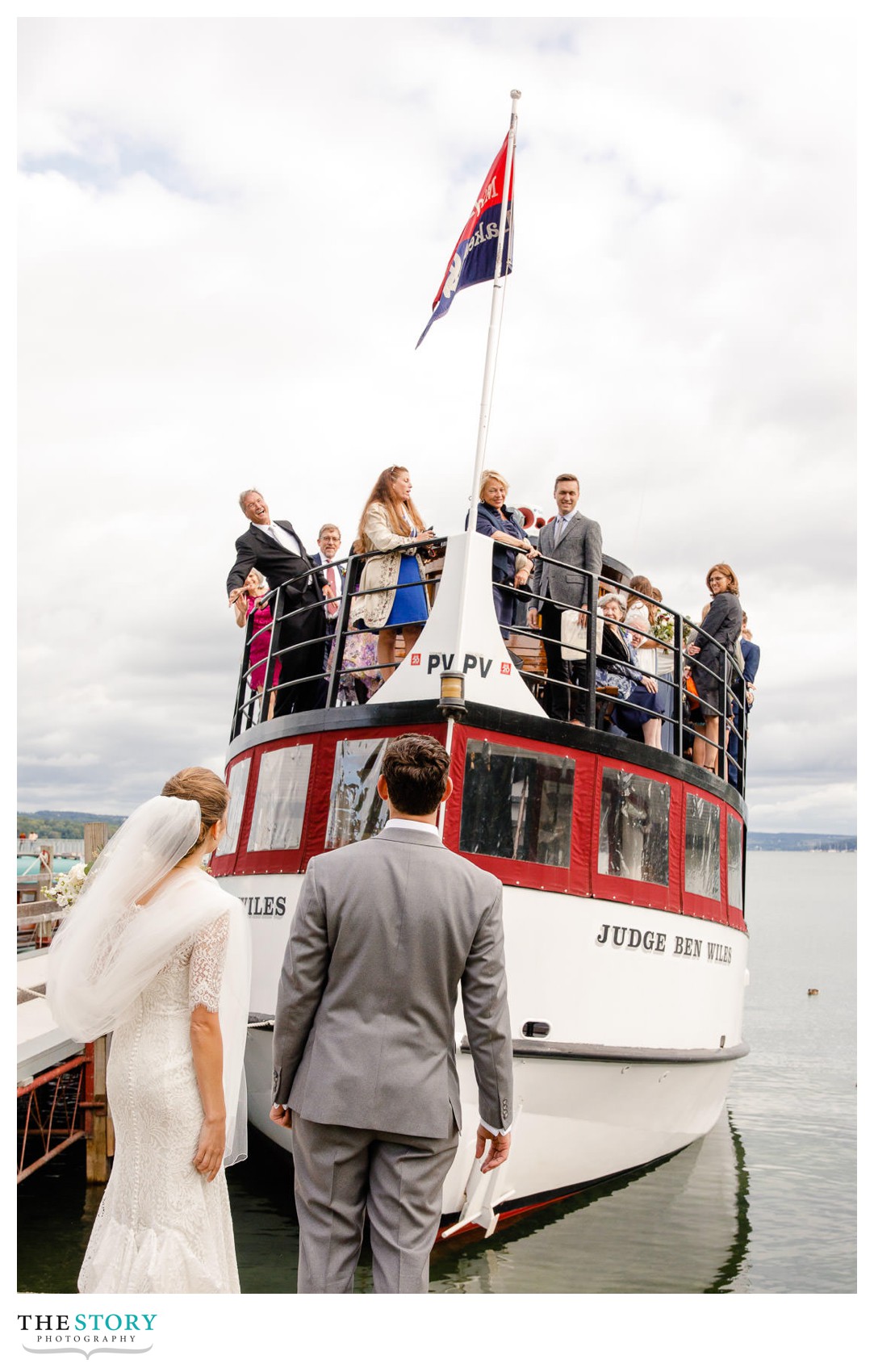 bride and groom viewing the amusing sight of the Judge Ben Wiles listing to the port side
