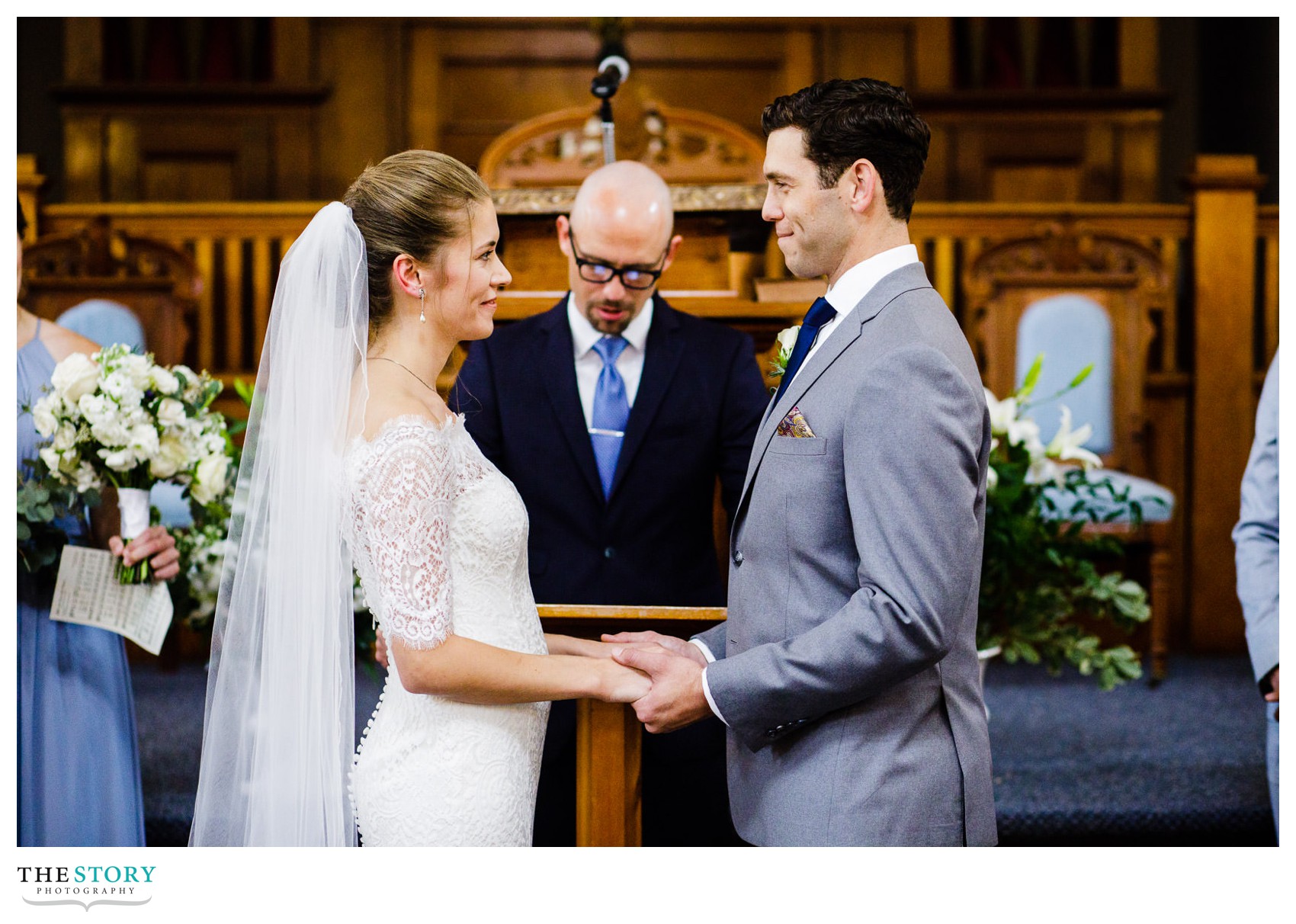 a little moment of bride and groom enjoying each other's glances during the wedding sermon