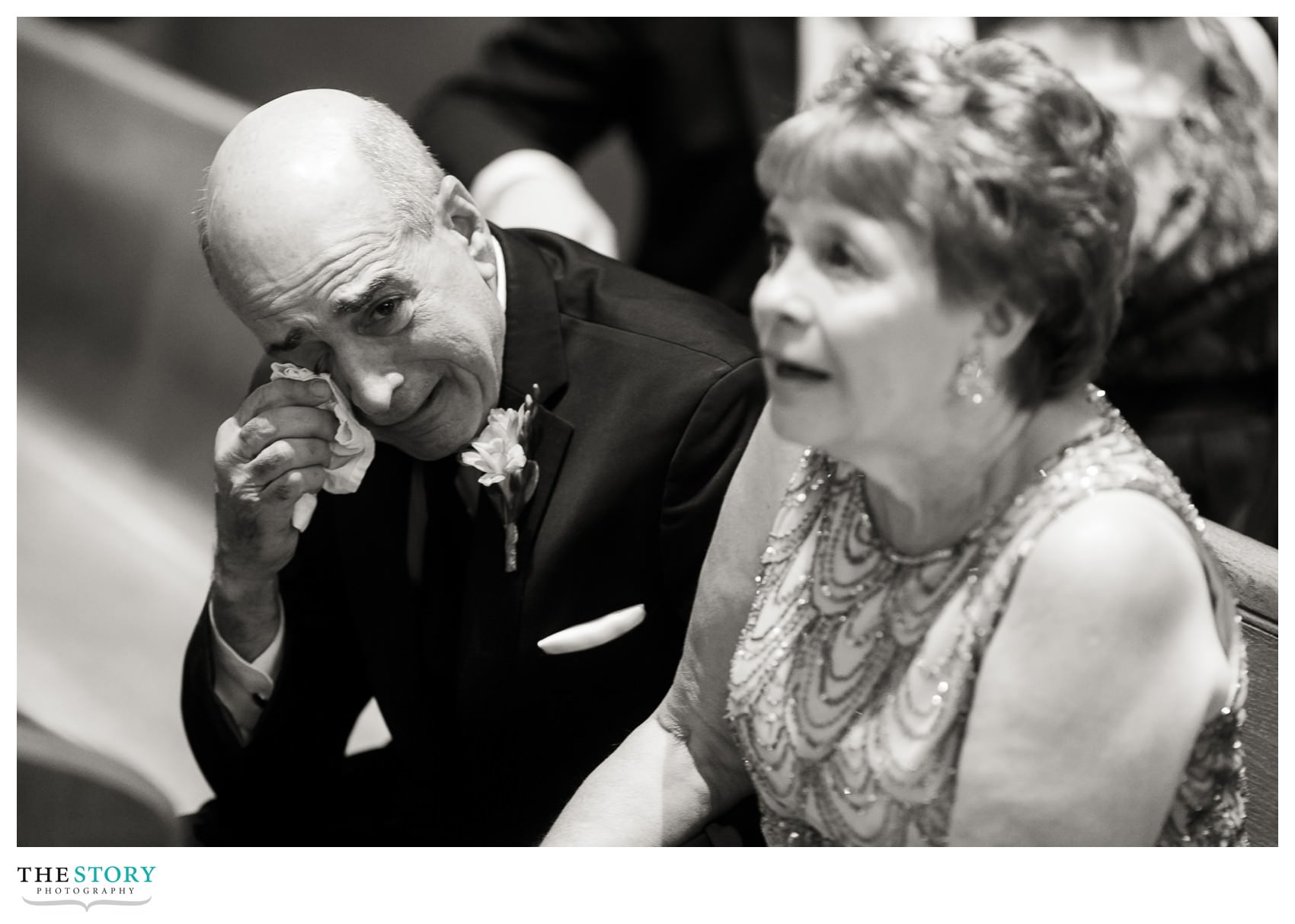 father of the groom wipes tears at Syracuse Cathedral wedding