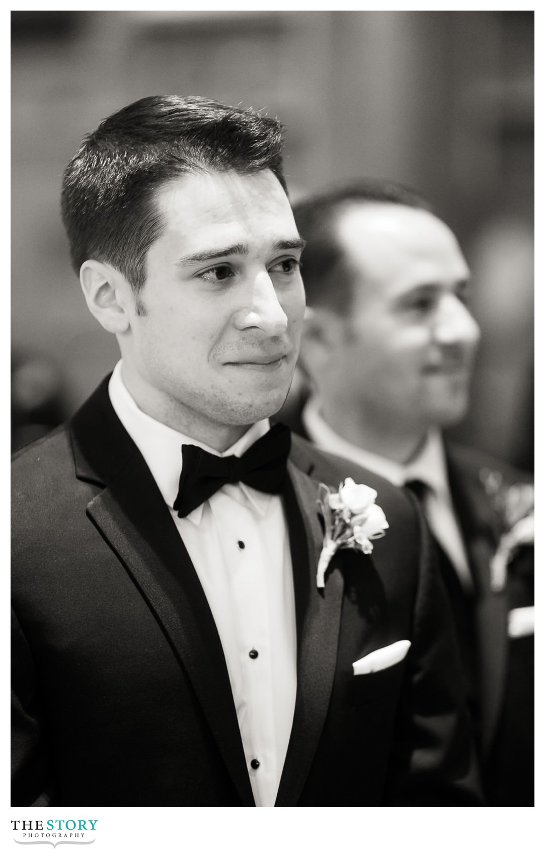 groom watches bride walk down the aisle at Syracuse wedding