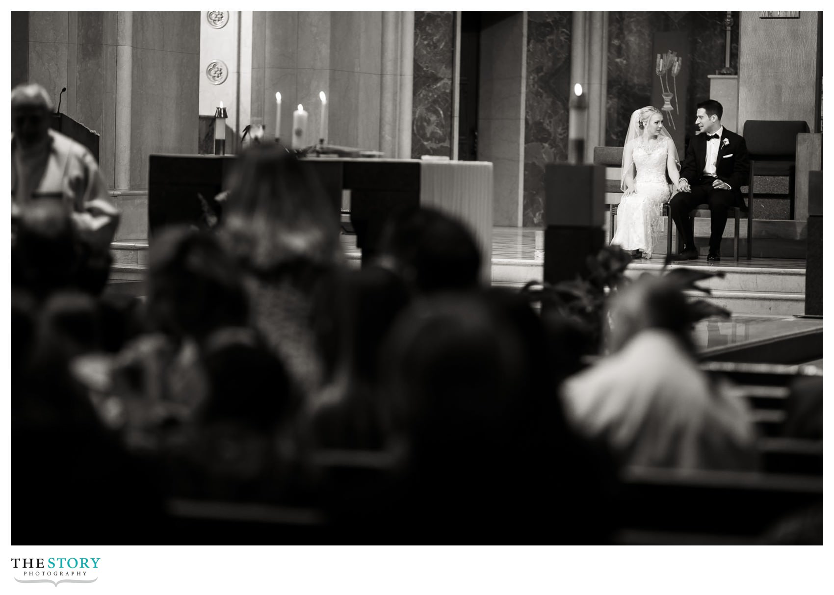 bride and groom enjoy a moment together during communion 