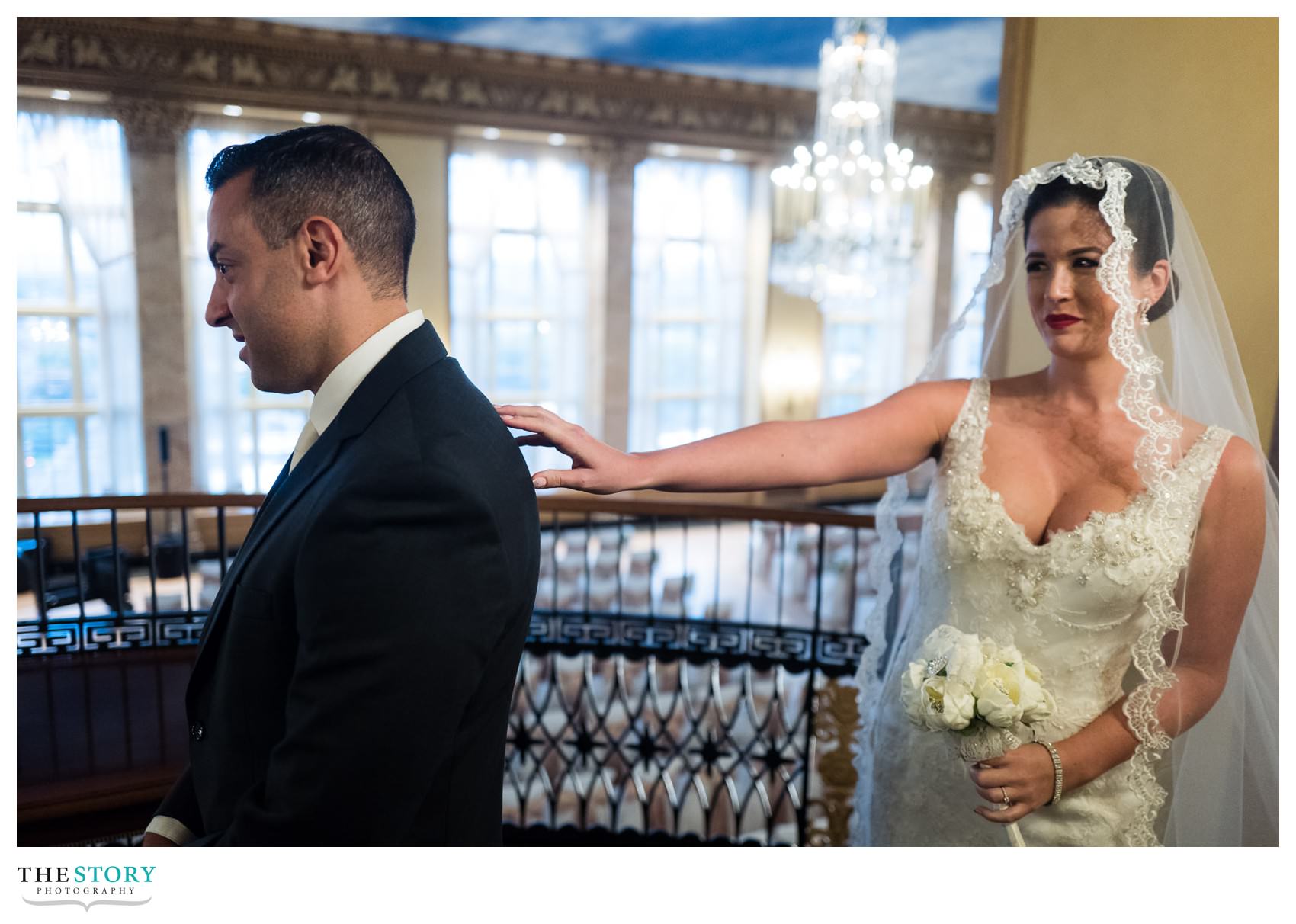 wedding day first look in grand ballroom at Hotel Syracuse