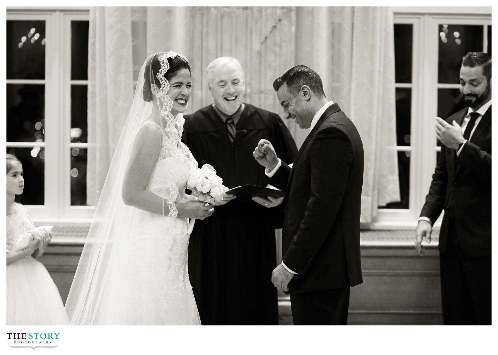 candid moment during ring exchange at Hotel Syracuse wedding ceremony 