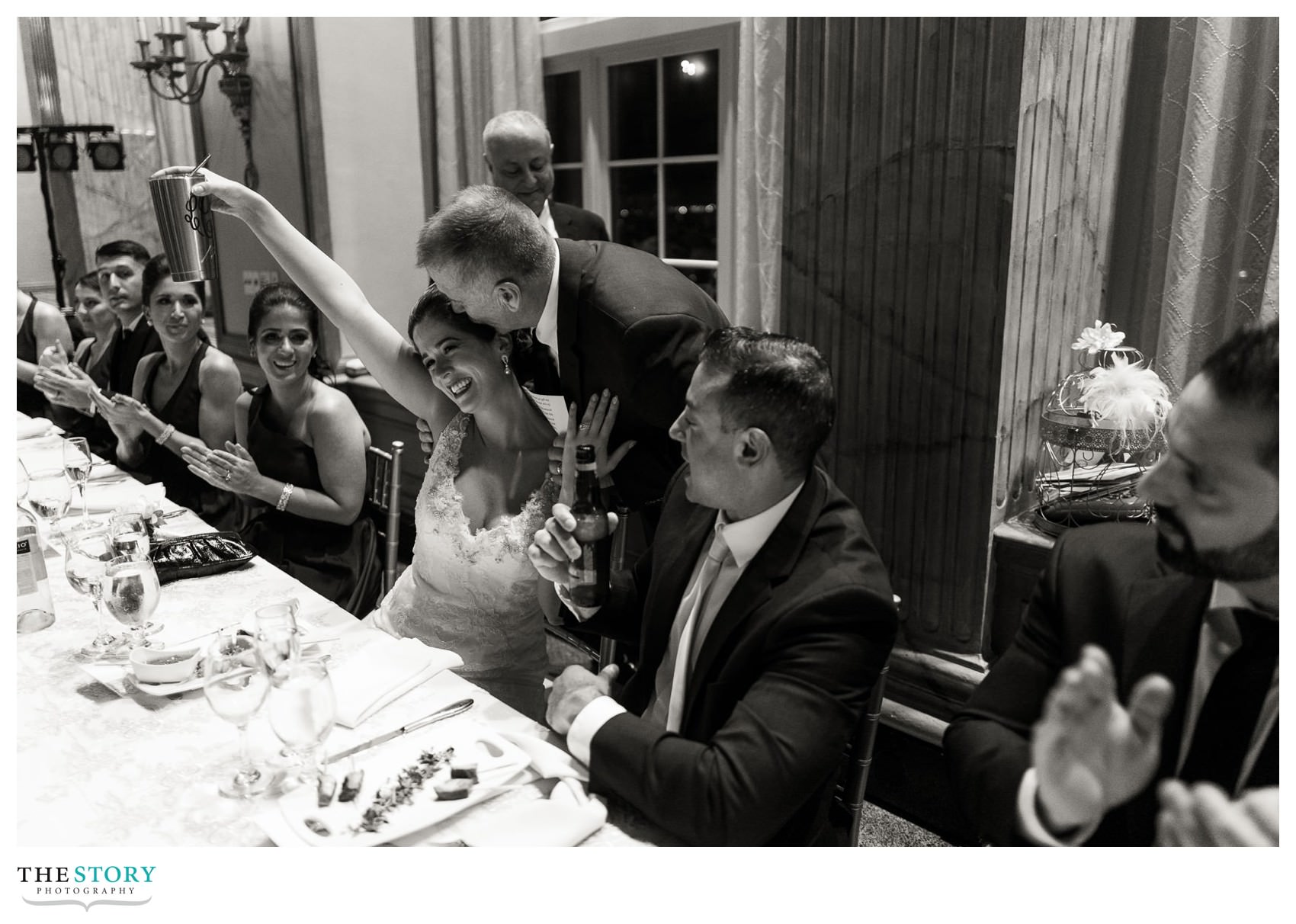 candid moment after father of the bride gives toast at wedding reception in Syracuse