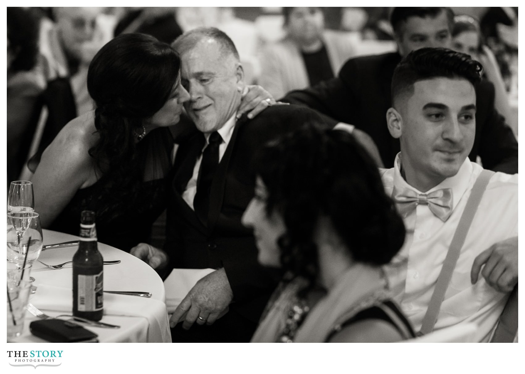 parents of the bride enjoy a little moment during wedding toasts at Hotel Syracuse