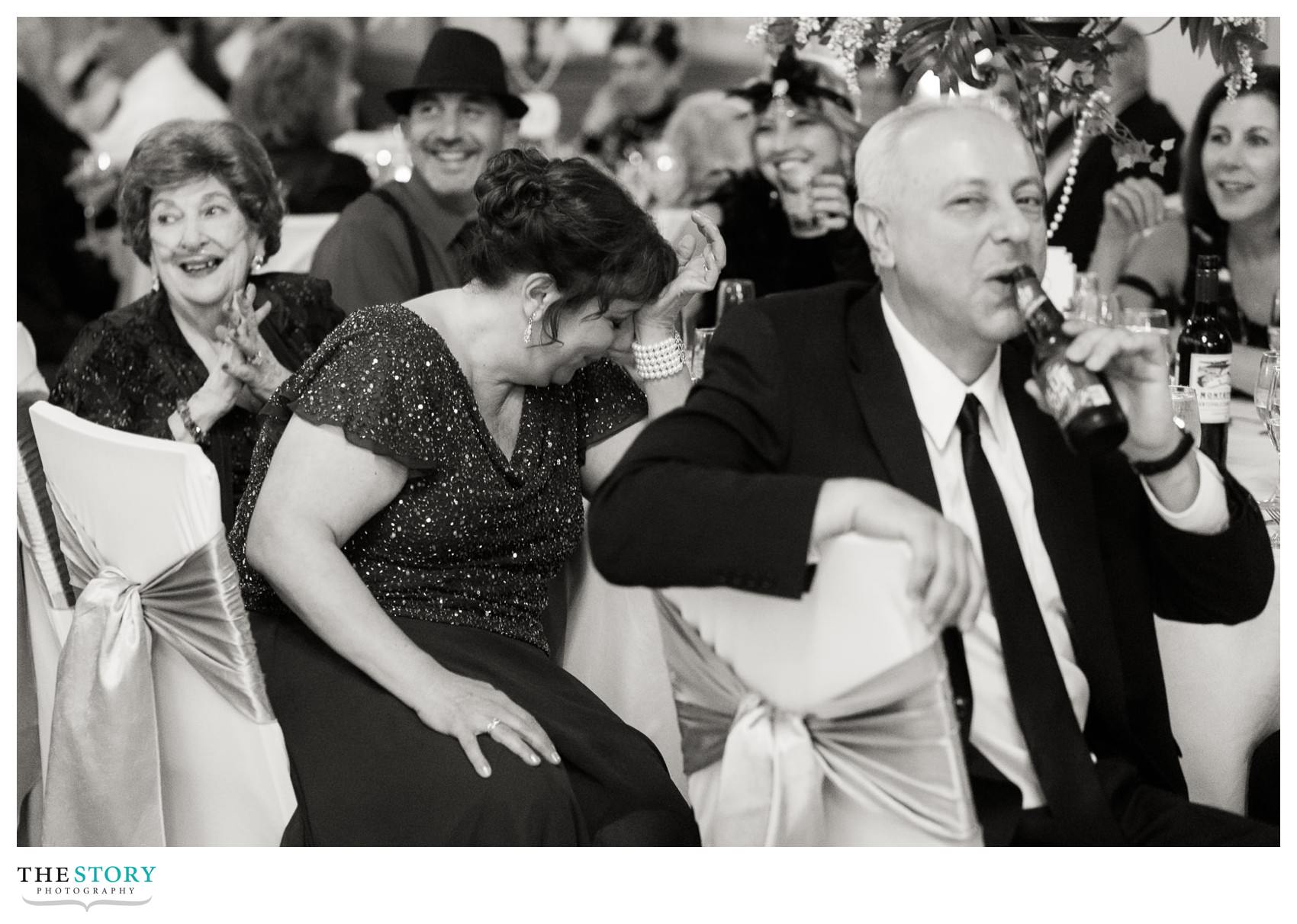 groom's mother reacts to best man speech at wedding reception