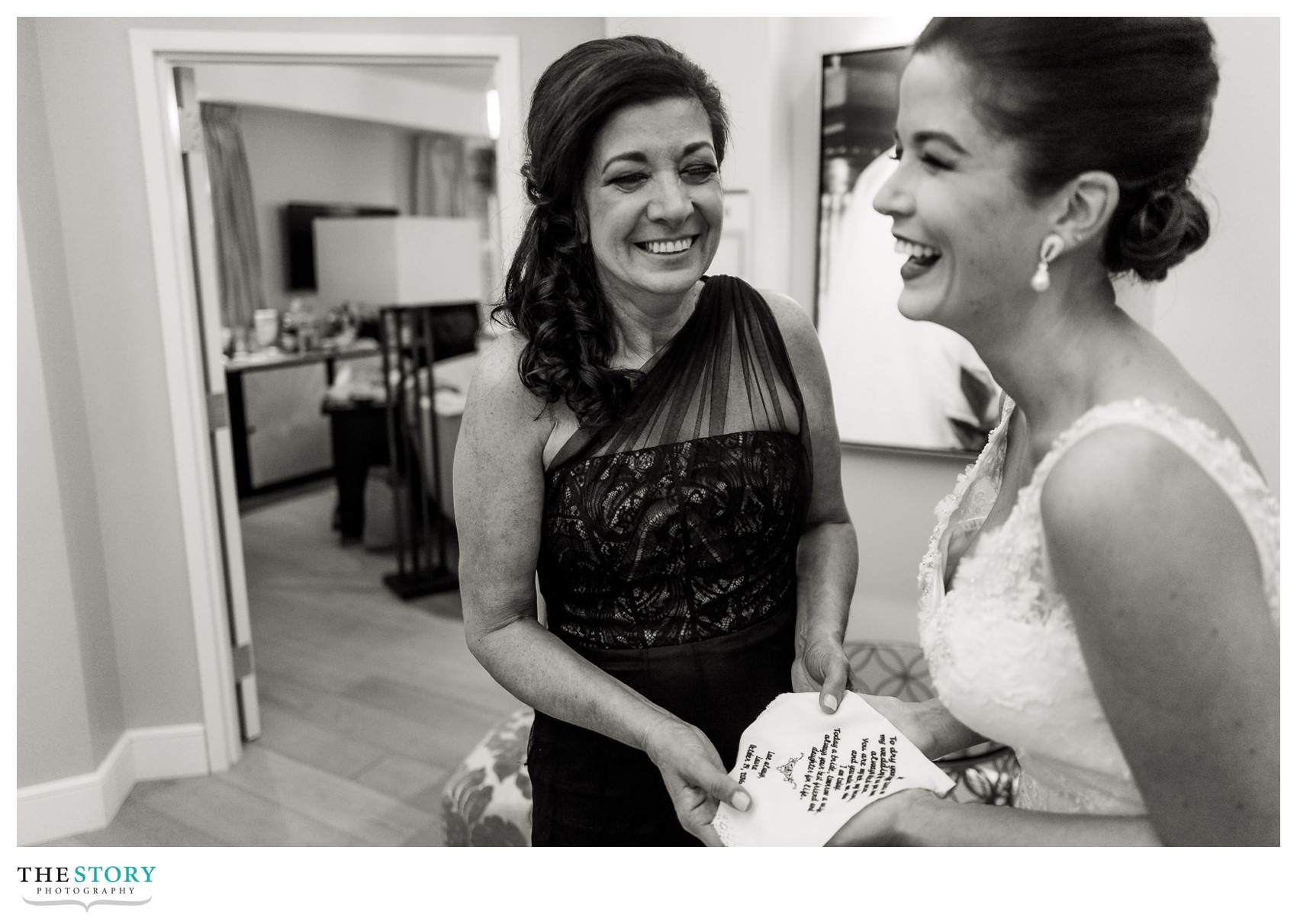 candid moment in bridal suite at Hotel Syracuse
