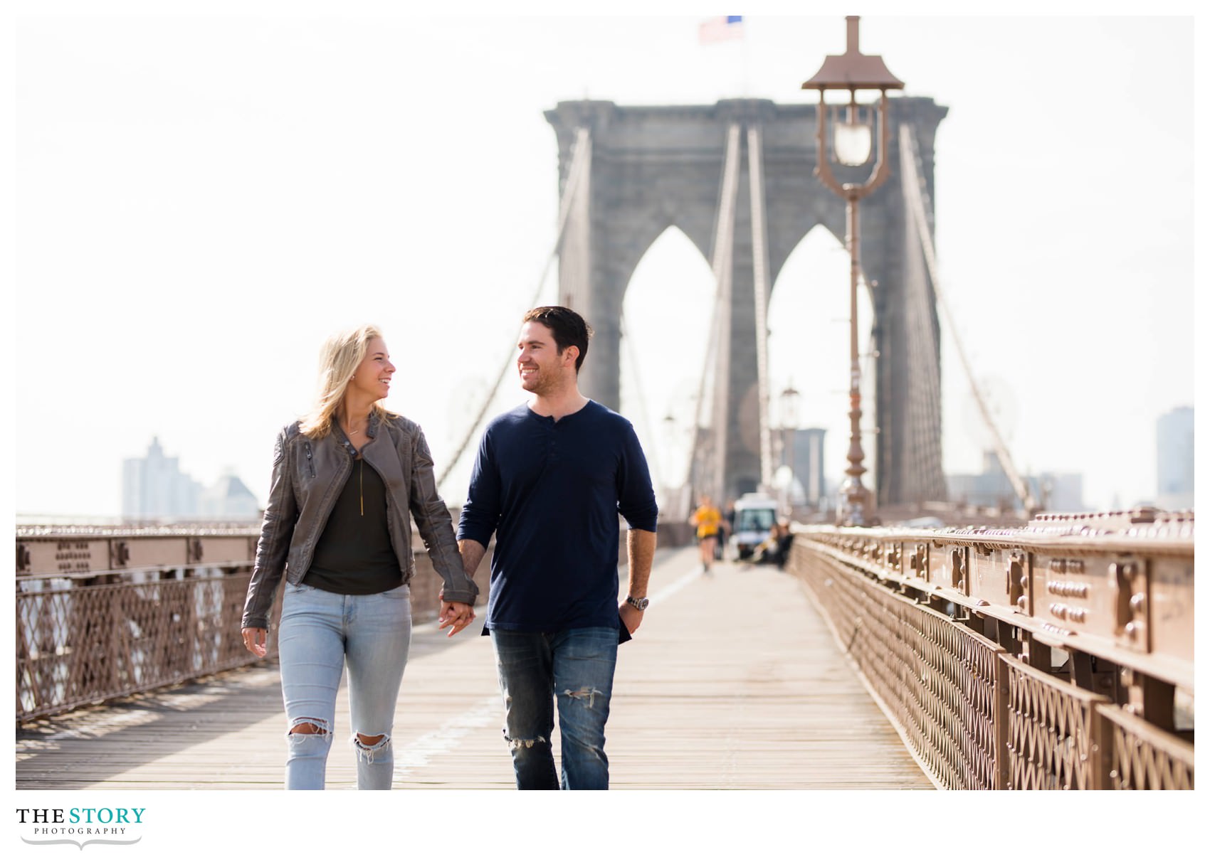 couple walking on Brooklyn Bridge