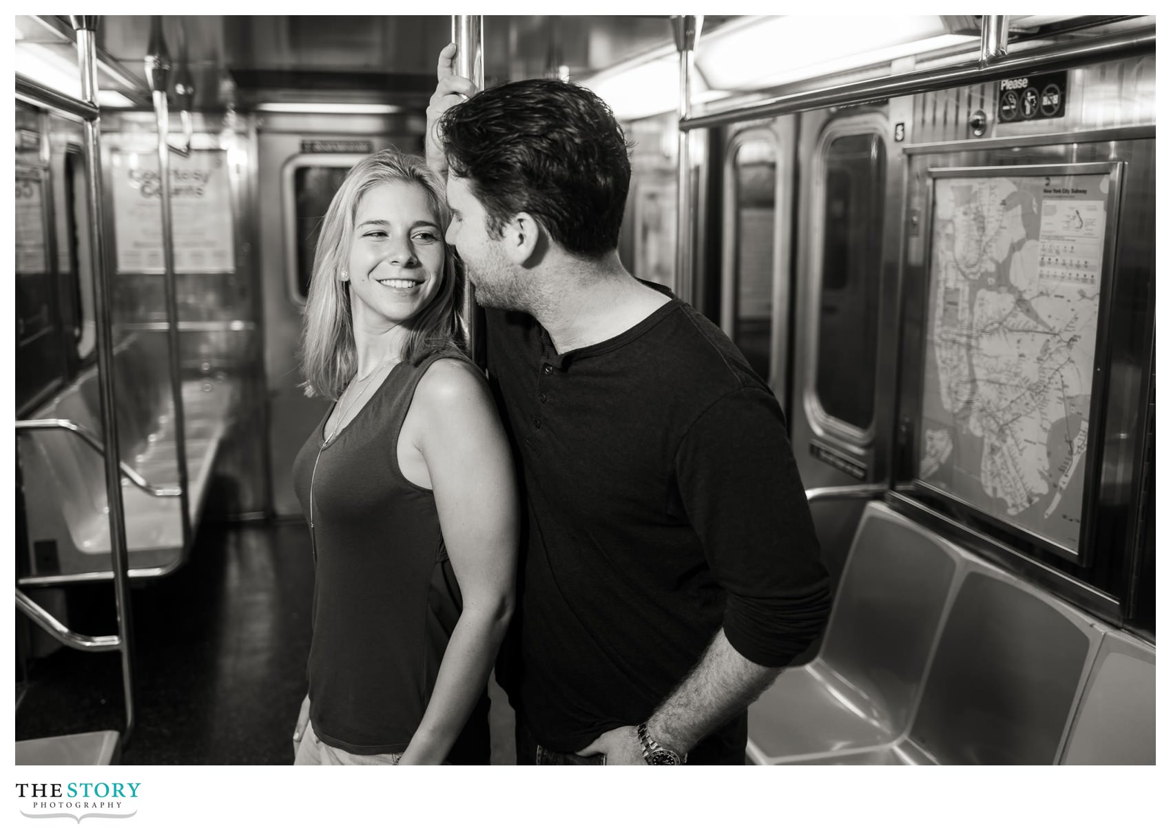 couple in NYC subway car alone for engagement photos