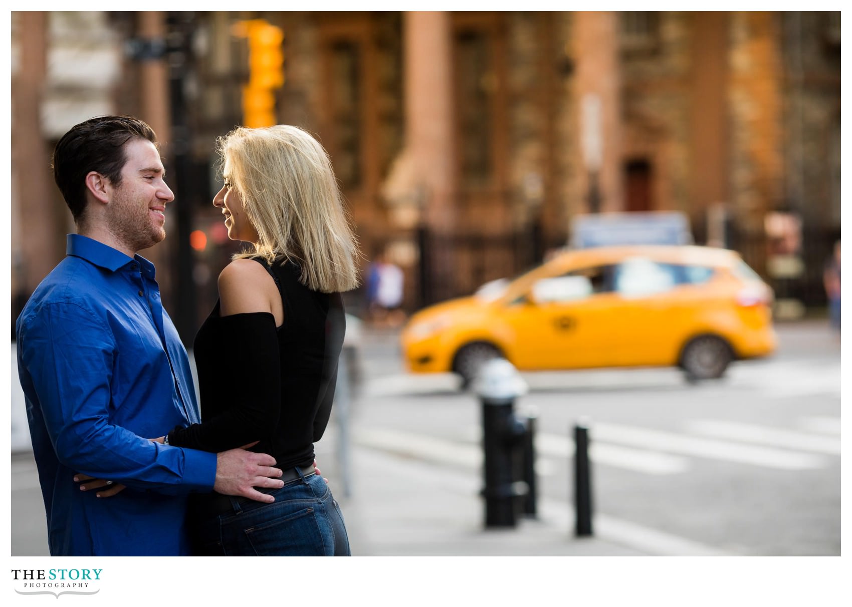 Park Row engagement photo with NYC taxi in background