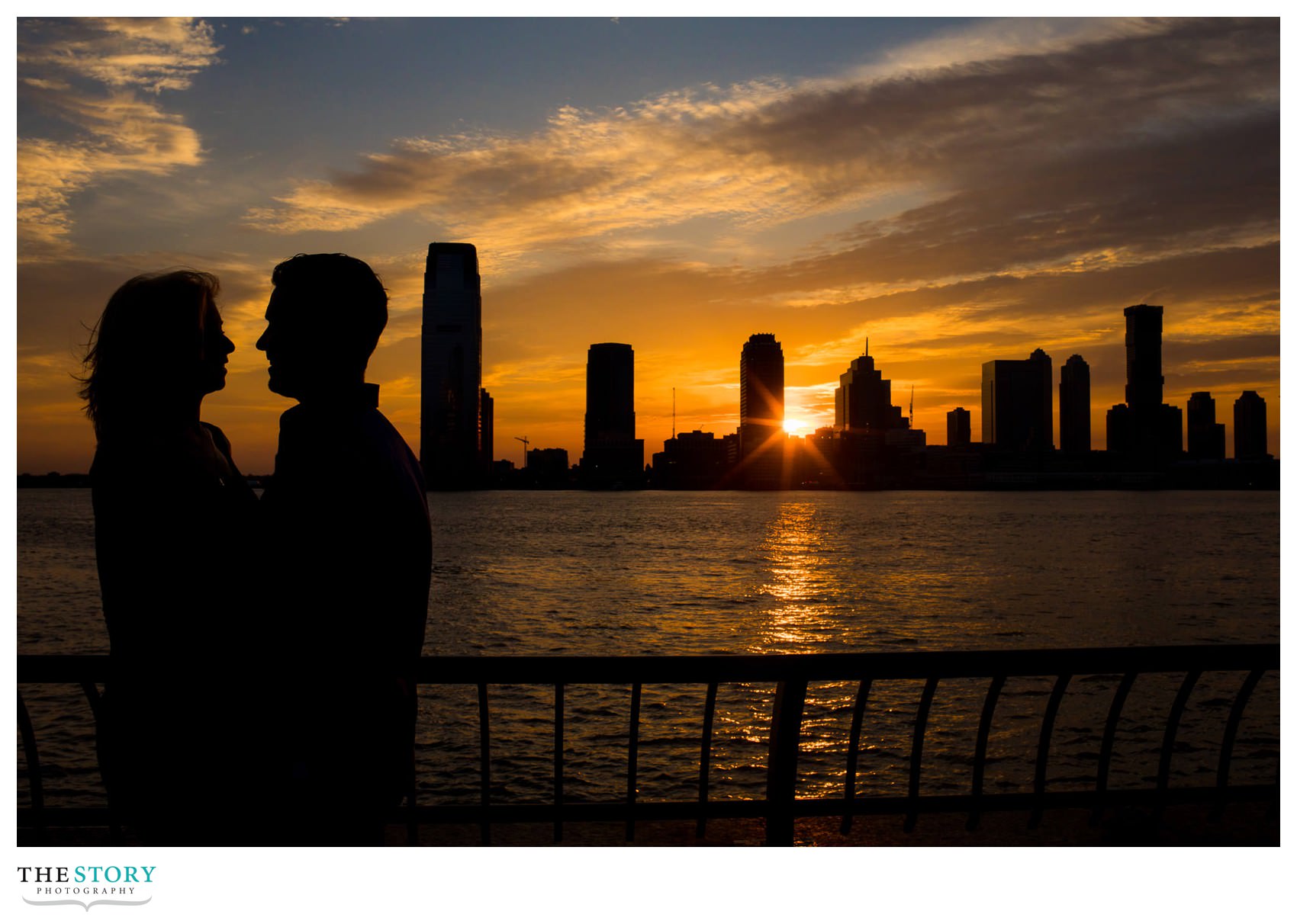 engagement photo with sunset over the Hudson River