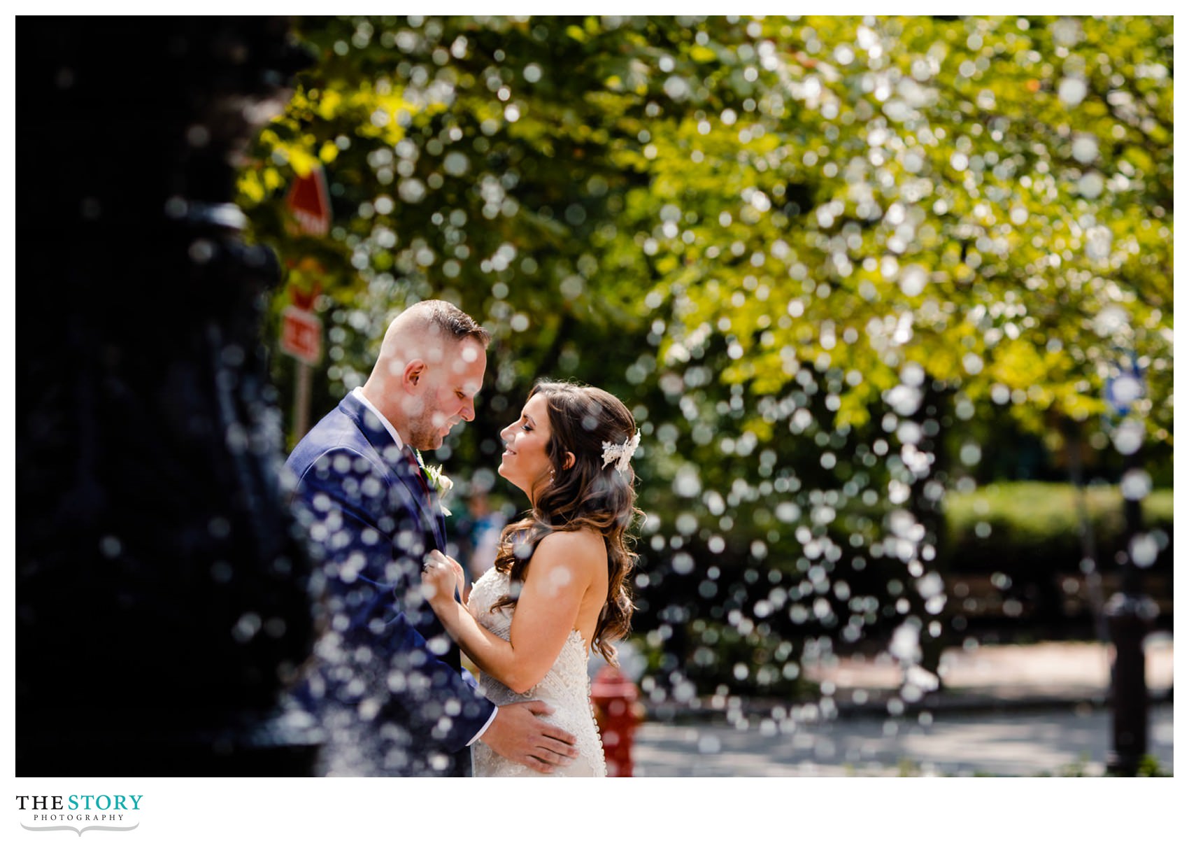 wedding portrait of bride and groom at the Franklin Square fountain