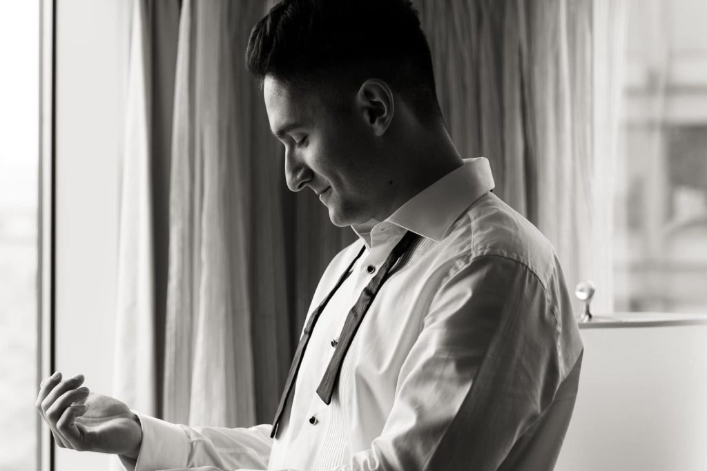 groom getting ready for wedding at Cornell's Statler Hotel