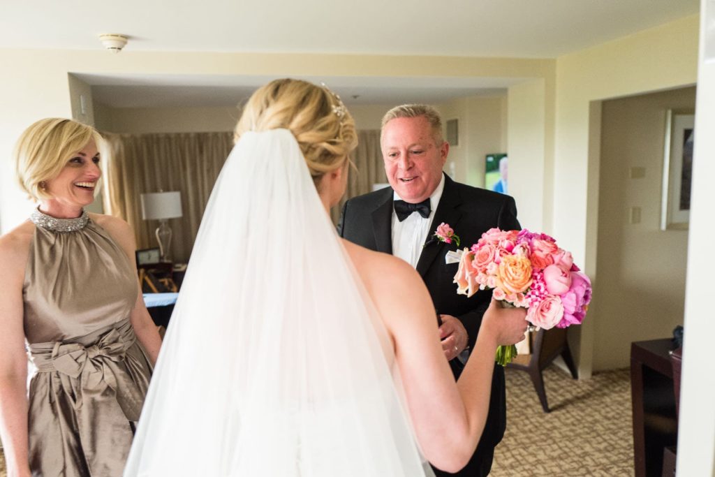 father of bride sees his daughter for the first time on the wedding day