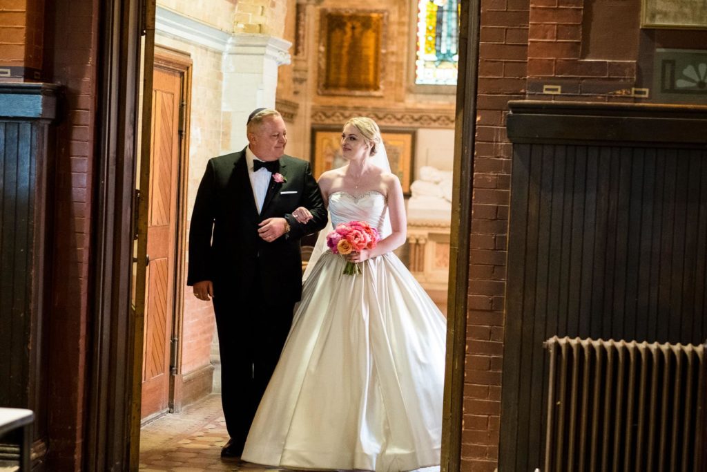 Bride and father enjoy one last moment before walking the aisle at Sage Chapel wedding