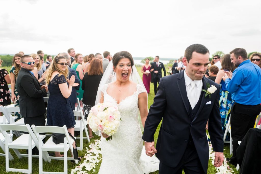 happy couple leaving wedding ceremony at Ventosa Vineyard